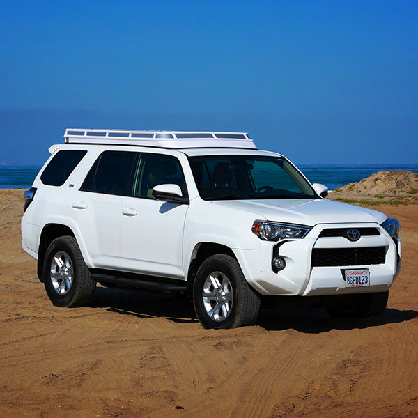 White 4Runner with Polar White Convoy Tent on beach