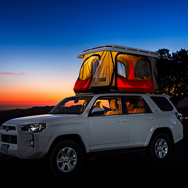 White 4Runner with Convoy Tent at sunset